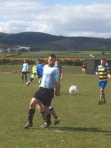 Paddy McEvoy grapples for possession while Chris Curran and Paul Maguire look on.