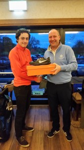 Winner, Girvan Carey, receives his prize from Phil