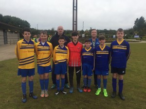 The boys showing our fantastic new Home and Away kits before the game.