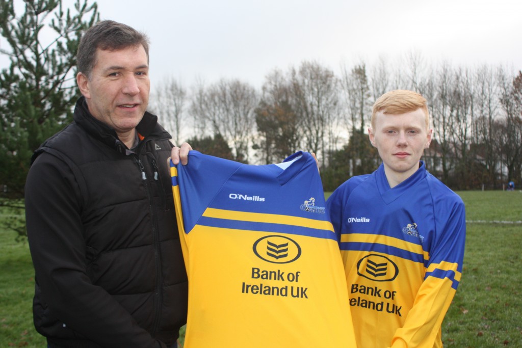 Henry Cleary, Senior Manager at Bank of Ireland, presents the new strip to Colts U17 team captain James Rodgers